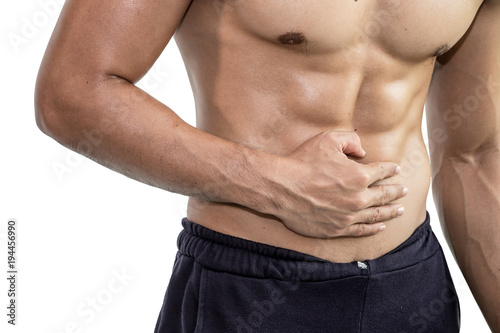 Muscular man having stomachache, Health concept