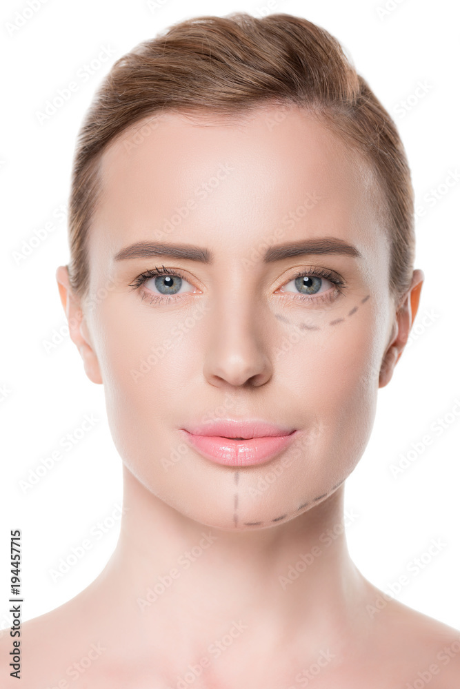 Portrait of woman with painted lines on face for plastic surgery isolateed on white Portrait of woman with painted lines on face for plastic surgery isolateed on white