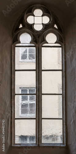 The old and ancient window in dark room