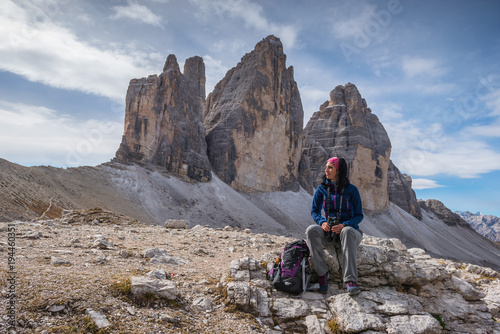 pretty young woman in italien dolomites, south tyrol, italien alps, tre cime di lavaredo photo