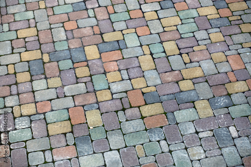 Multicolored paving slabs. Pavement background. Cobblestone texture.