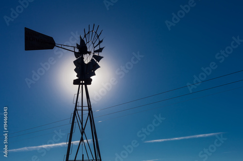 Wind pump windmill silhouette in the Karoo desert of South Africa