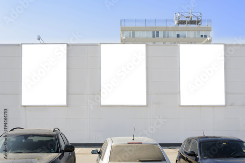 Three blank billbord on a wall, place for text