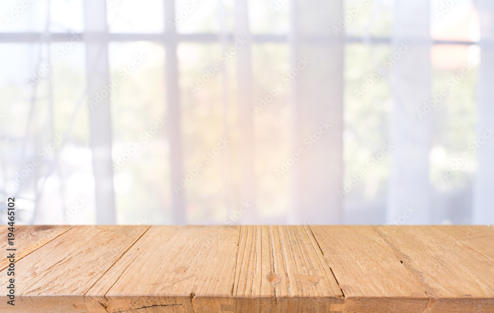 Empty wooden table in front of abstract blurred background of coffee shop . can be used for display or montage your products.Mock up for display of product. Empty wooden table in front of abstract blurred background of coffee shop . can be used for display or montage your products.Mock up for display of product.