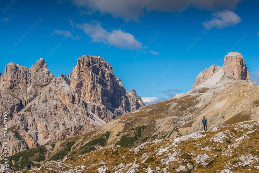 young man with map in italien dolomites, loving nature and climbing, tre cime di lavaredo