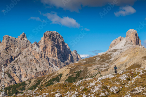 young man with map in italien dolomites, loving nature and climbing, tre cime di lavaredo