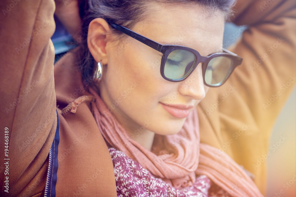 Relaxed smiling woman portrait with sunglasses. Caucasian couple in love roadtrip vacation italian travel on convertible car Relaxed smiling woman portrait with sunglasses. Caucasian couple in love roadtrip vacation italian travel on convertible car