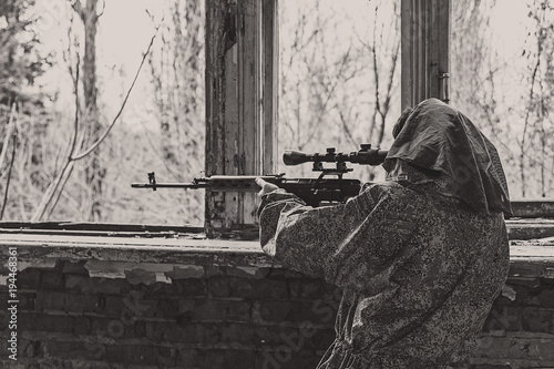 in the ruins of the building sniper waiting for the target