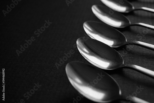 metal spoons on a dark background