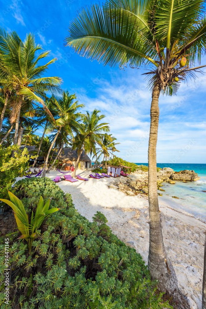 Recreation at paradise beach resort with turquoise waters of Caribbean Sea at Tulum, close to Cancun, Riviera Maya, tropical destination for vacation, Mexico