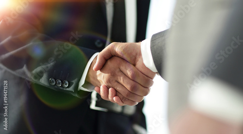 Business men giving a handshake. Business concept photo