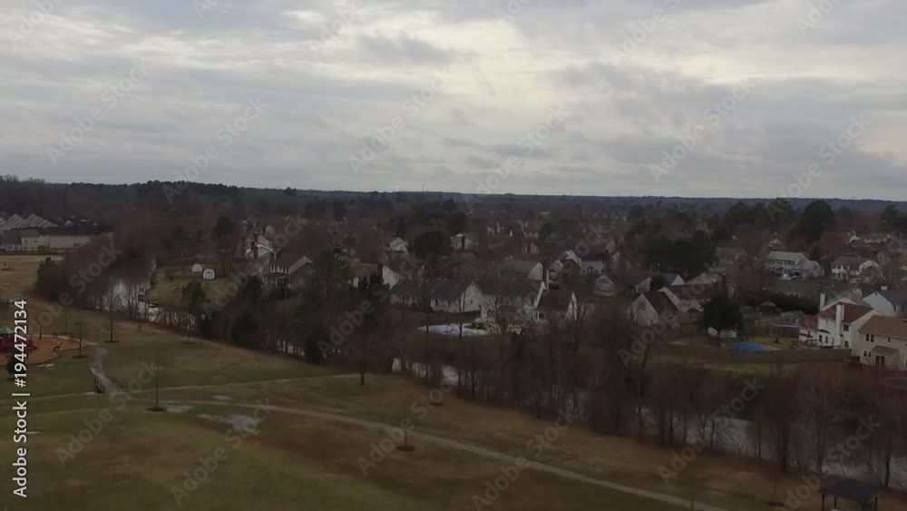 Aerial Shot of American Suburban Area with Creek During Early Spring with Snow Melt Flooded Field Aerial Shot of American Suburban Area with Creek During Early Spring with Snow Melt Flooded Field