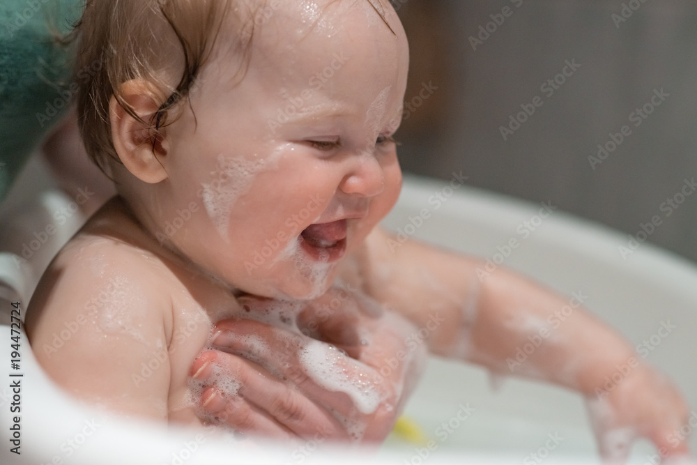 Bathing baby in the tub. Bathing baby in the tub.