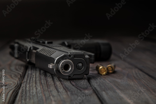 black pistol and cartridges...
