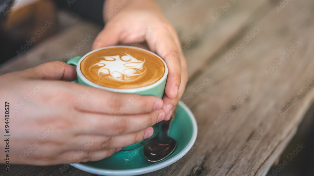 Woman Hands Holding Hot Latte Coffee Woman Hands Holding Hot Latte Coffee