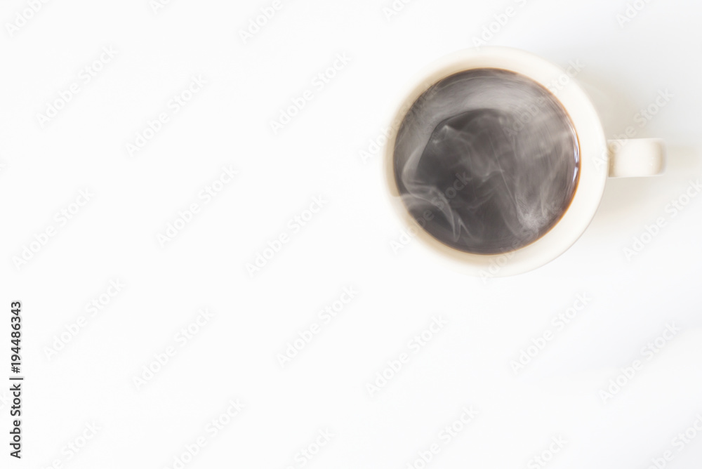 Hot coffee with smoke ready to drink on a white background. View
