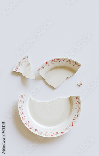 Empty cracked plate on white background. 3d illustration