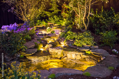Brightly Lit Waterfall and Pond