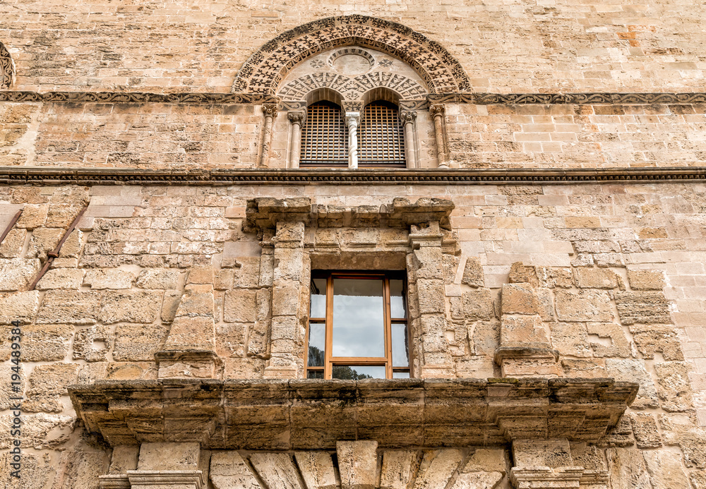 Wall with Mullioned windows with lava stone inlays of the Palace Steri Chiaramonte, Palermo, Sicily, southern Italy