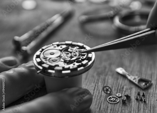 The process of installing a part on a mechanical watch, watch repair
