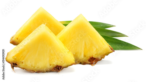healthy background. pineapple slices with green leaves isolated on white background