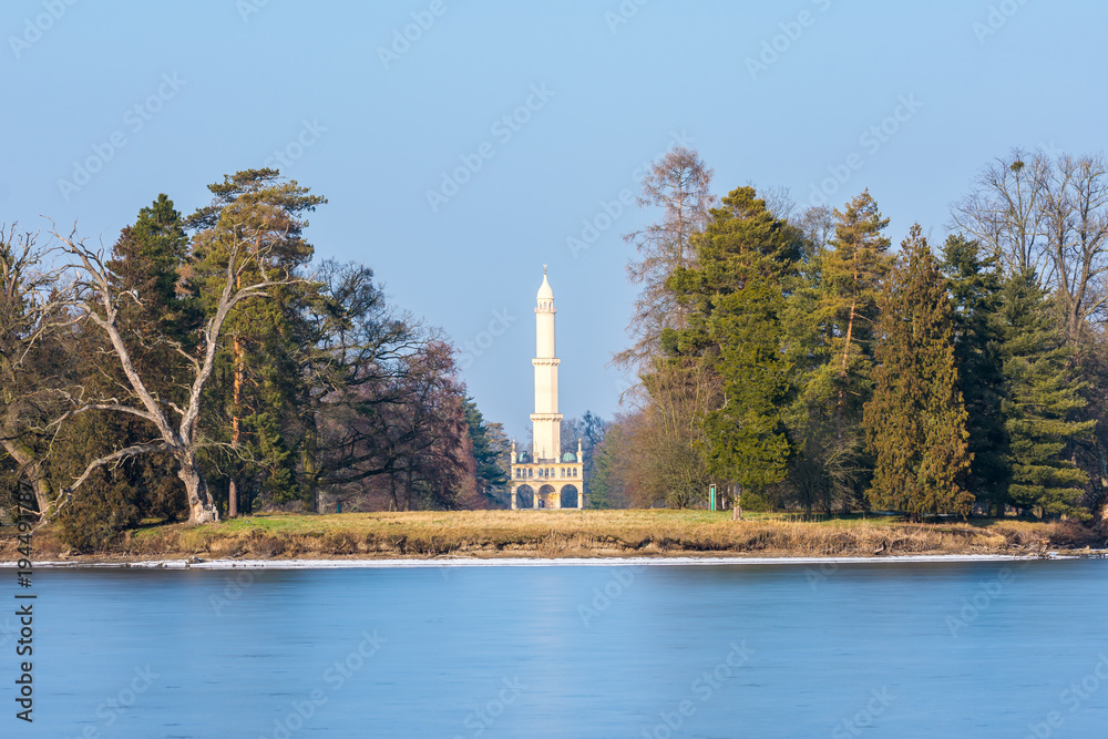 Minaret at Lednice castle, Czech Republic historical place, the lake in foreground