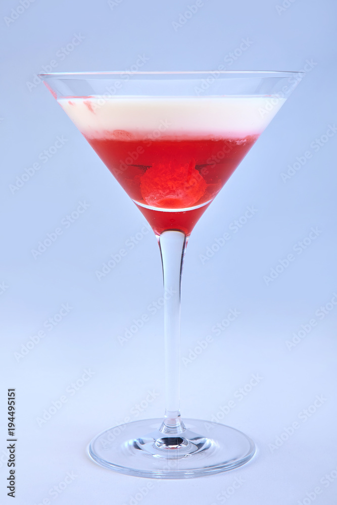 Delicious cocktail with raspberry and cream in martini glass Delicious cocktail with raspberry and cream in martini glass