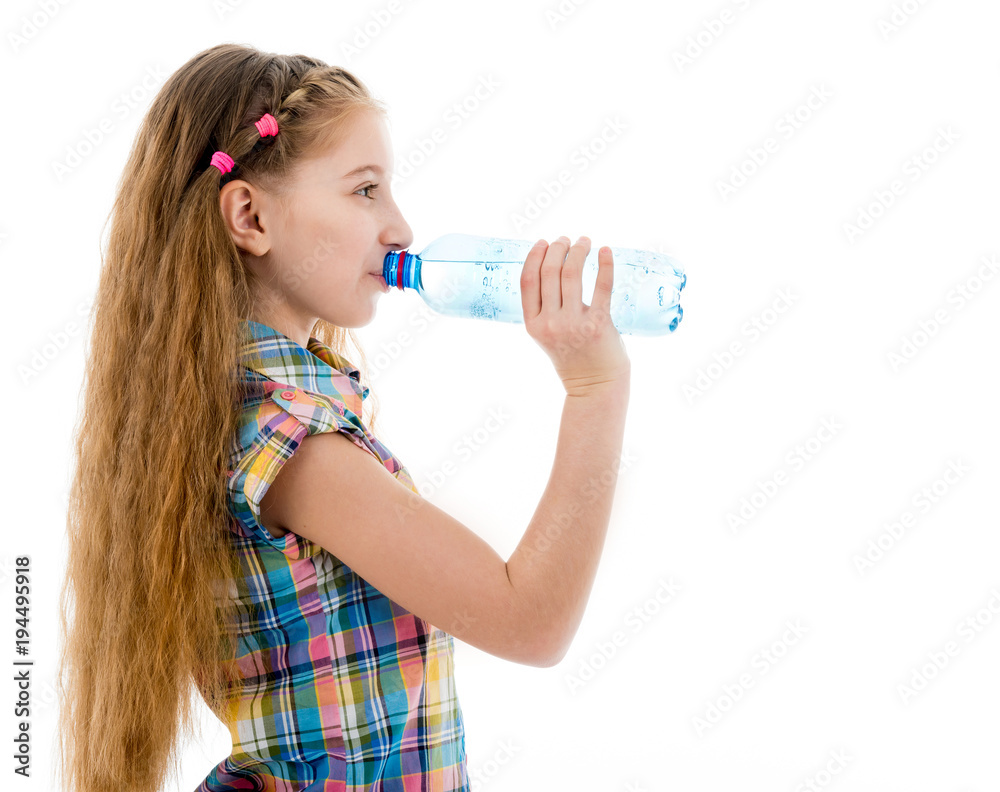 Girl drinking mineral water from bottle Girl drinking mineral water from bottle
