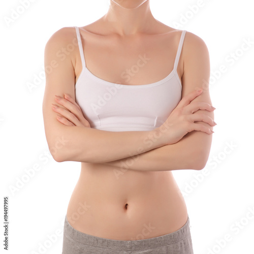 Young beautiful woman in white jersey top brafolded hands health beauty isolated © Kabardins photo