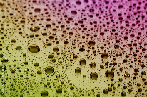 Close up of water drops at a glass table 