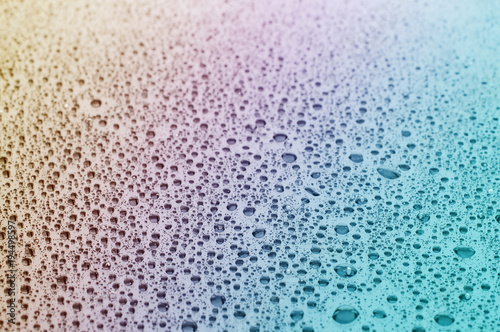 Close up of water drops at a glass table 