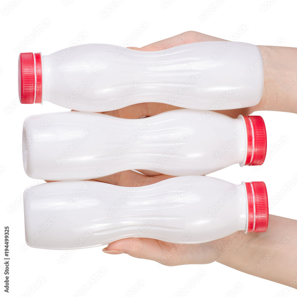 White plastic bottle with yoghurt kefir milk in hand
