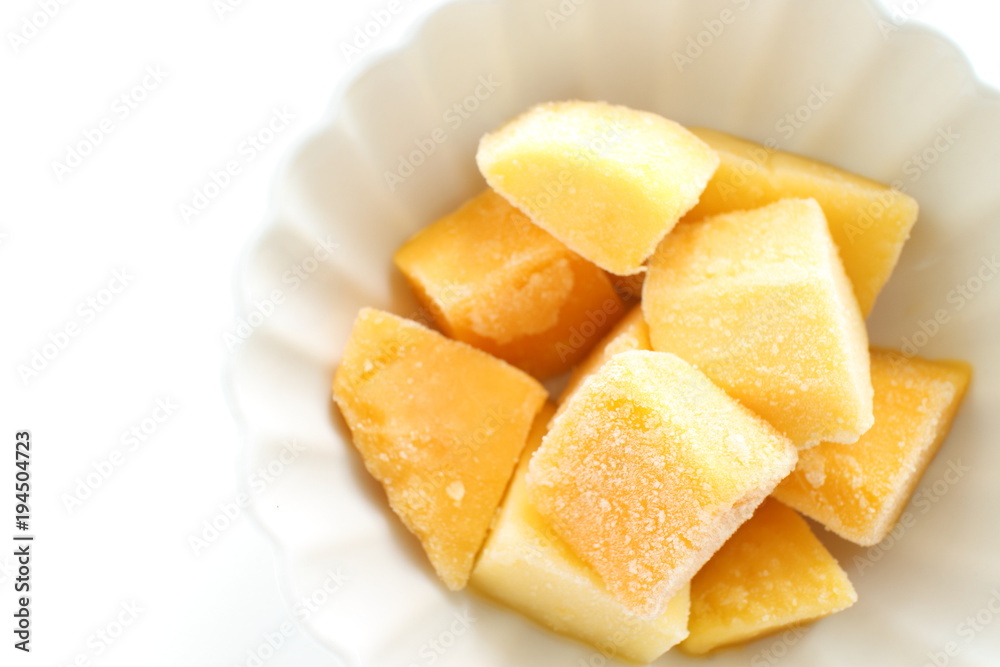 Frozen mango on white background for dessert image