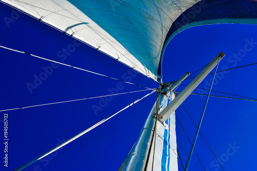 Sailing yacht against the blue sky.