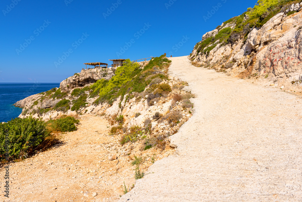 Mountain road and blue sky. Western side of Zakynthos island. Zante, Greece Mountain road and blue sky. Western side of Zakynthos island. Zante, Greece