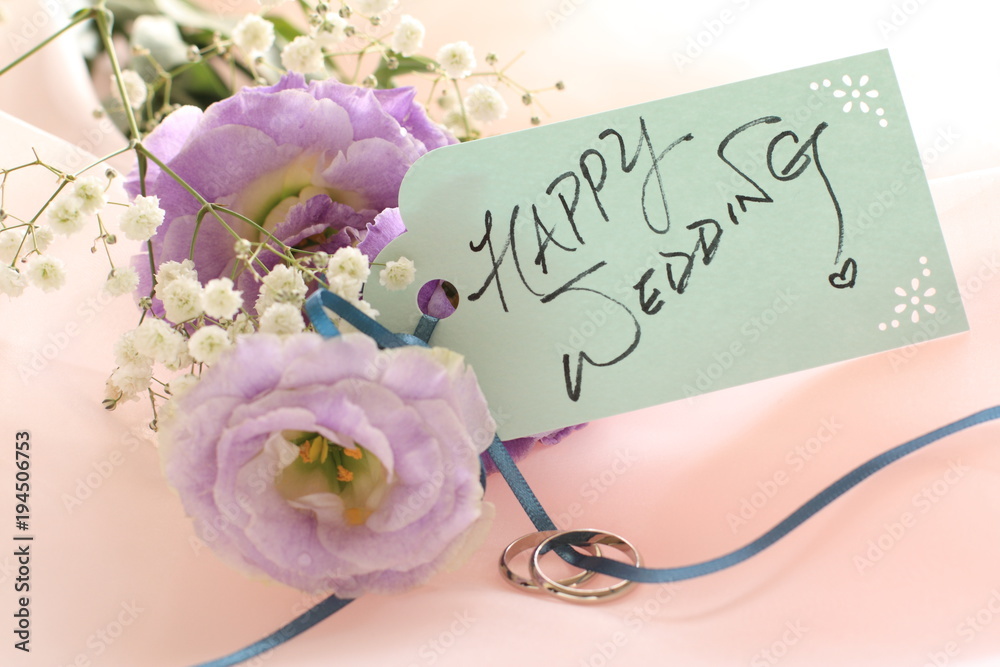 Fototapeta premium purple flower and wedding message on white background 