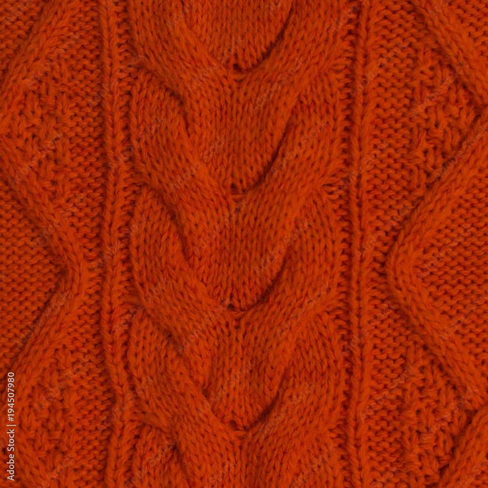 Knitted background. Knitted red texture. A knitting pattern of wool. Knitting. Background.