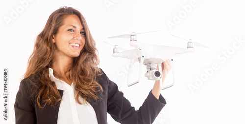Beautiful business woman holding a drone; technology concepts, copy space photo