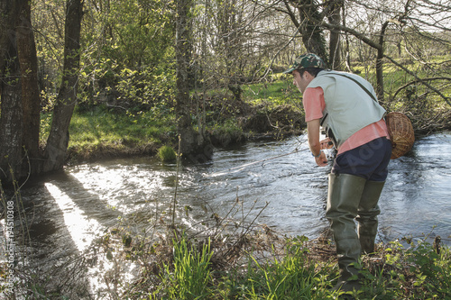 sport fisherman in river, Galicia, Spain.