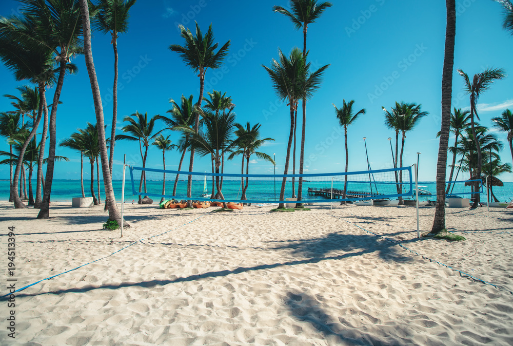 Volleyball net on tropical beach, caribbean sea