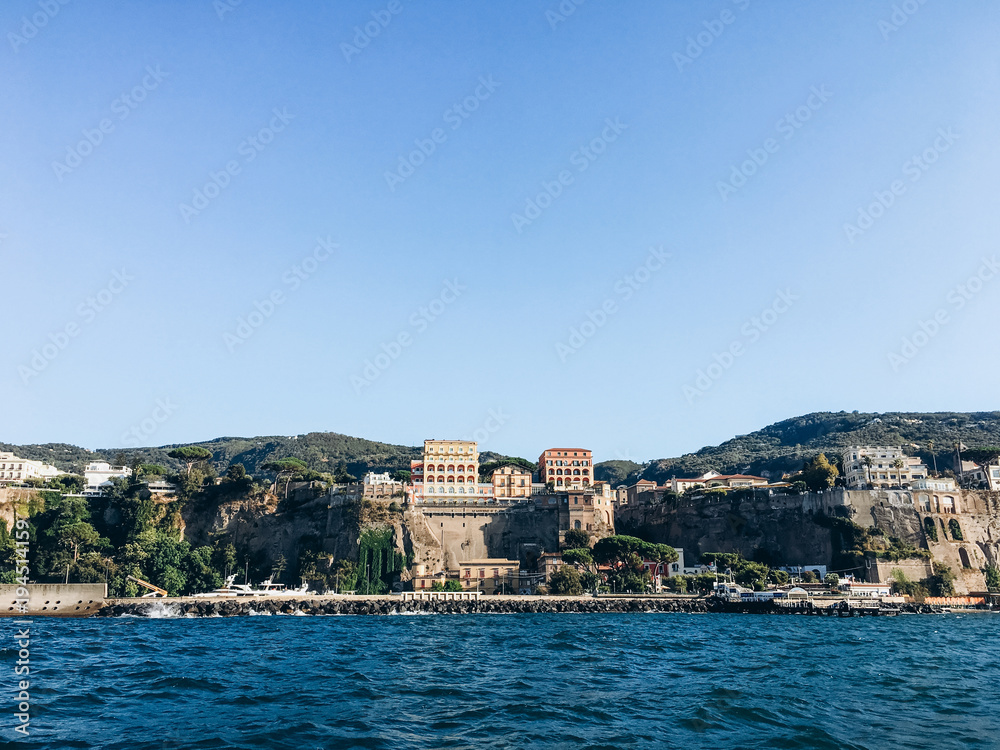 View of the beautiful Italian small town in the Mediterranean Sea. Mediterranean blue sea