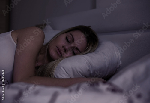 Woman sleeping at night.