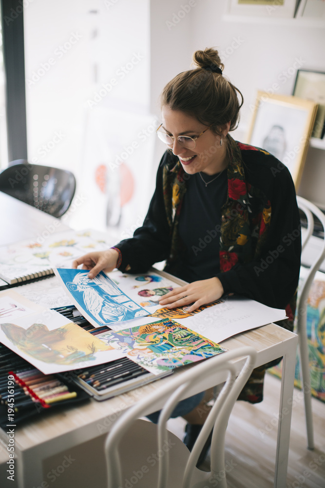 Designer working in her studio. Designer working in her studio.