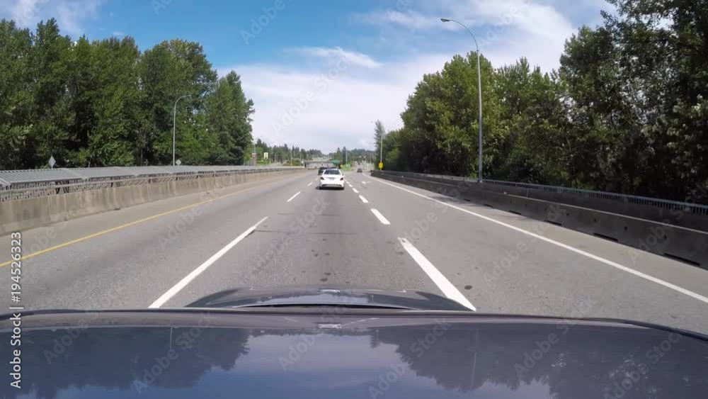 Vehicle POV while driving fast along Highway 99 on a sunny day Vehicle POV while driving fast along Highway 99 on a sunny day