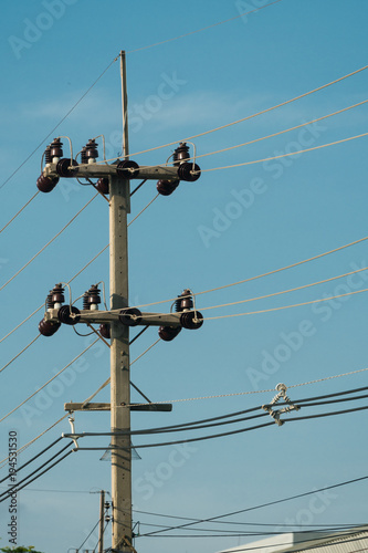 3 phases powerlines pose with blue sky background