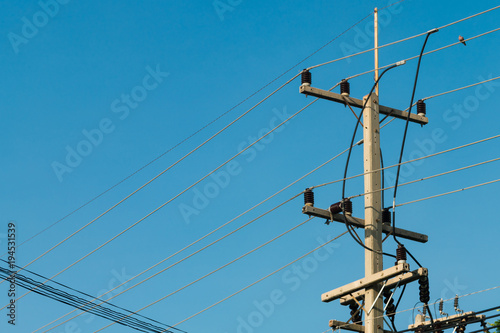 3 phases powerlines pose with blue sky background