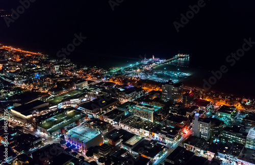Aerial view of the Santa Monica shoreline  amusment park and pier at night