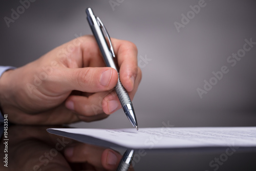 Businessperson Signing Document