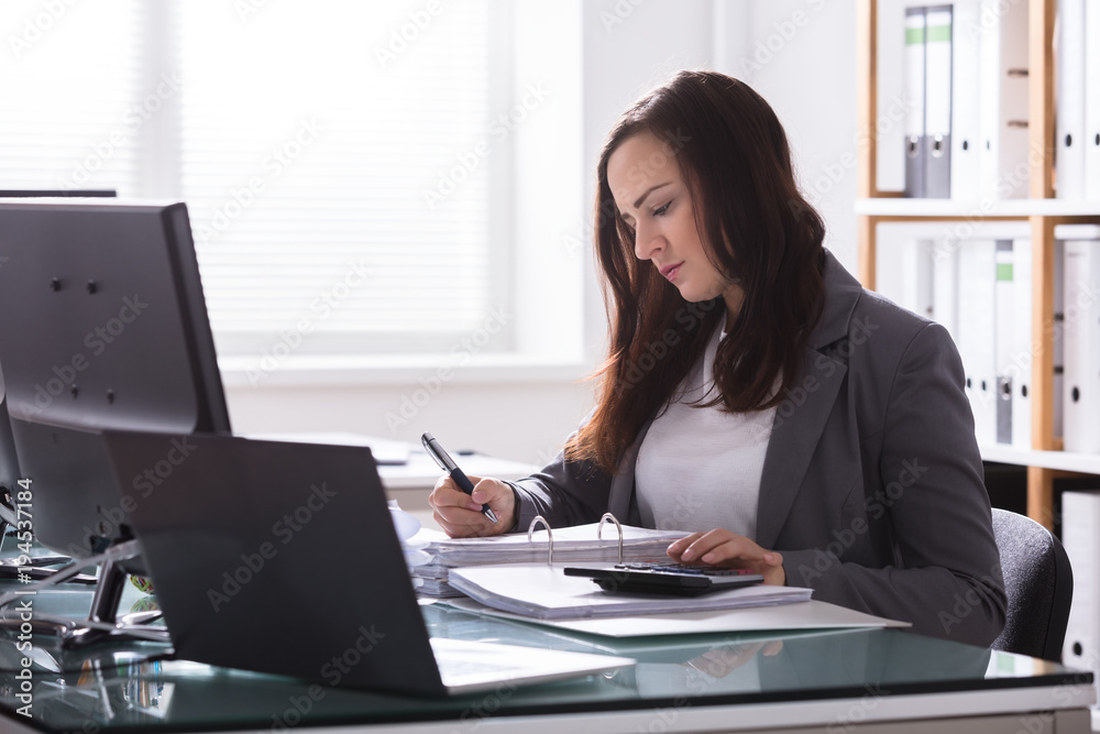 Happy Businesswoman Calculating Bill Happy Businesswoman Calculating Bill