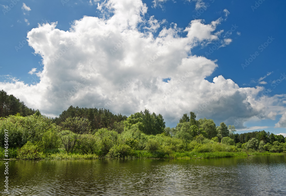 The lake is surrounded by trees along the banks